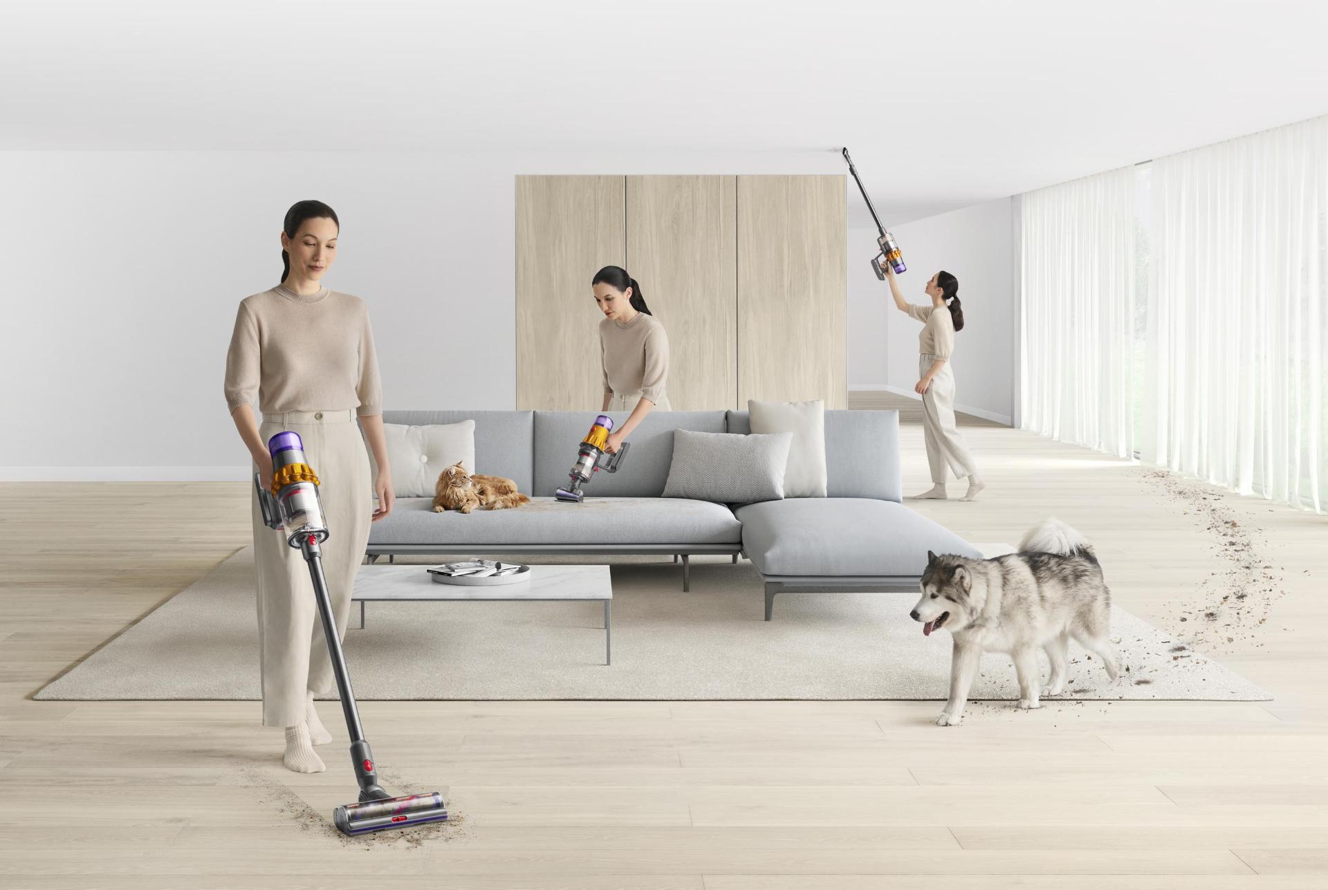 Woman using a Dyson cordless vacuum to clean all around the home