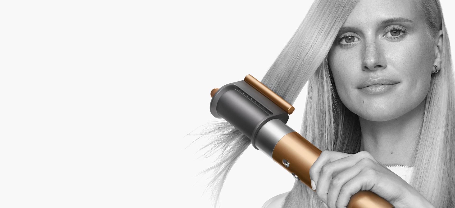 Model with type 1 hair using the Dyson coanda smoothing dryer.