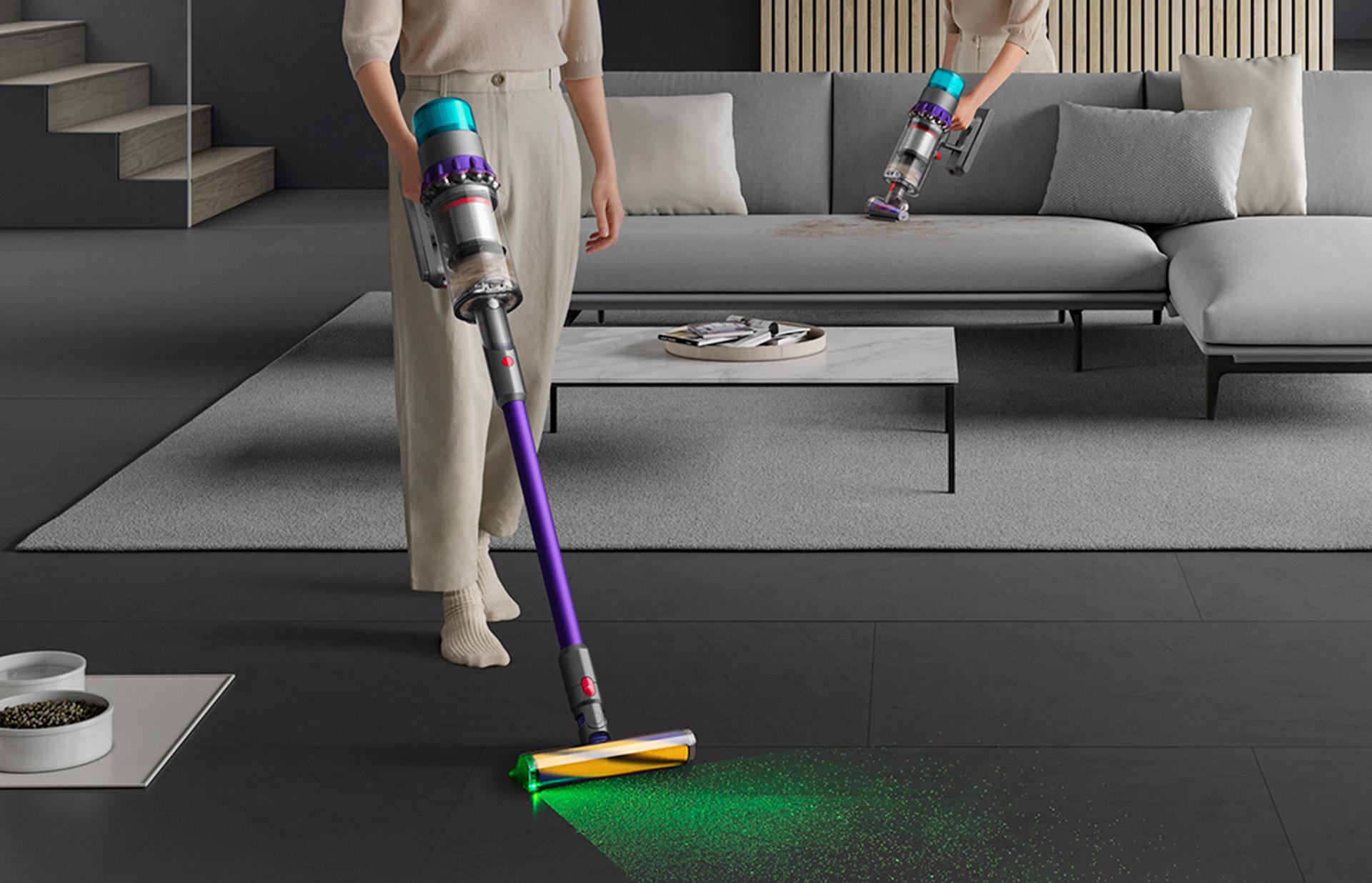 A woman cleaning hard floor and carpet with a Dyson V11™ vacuum
