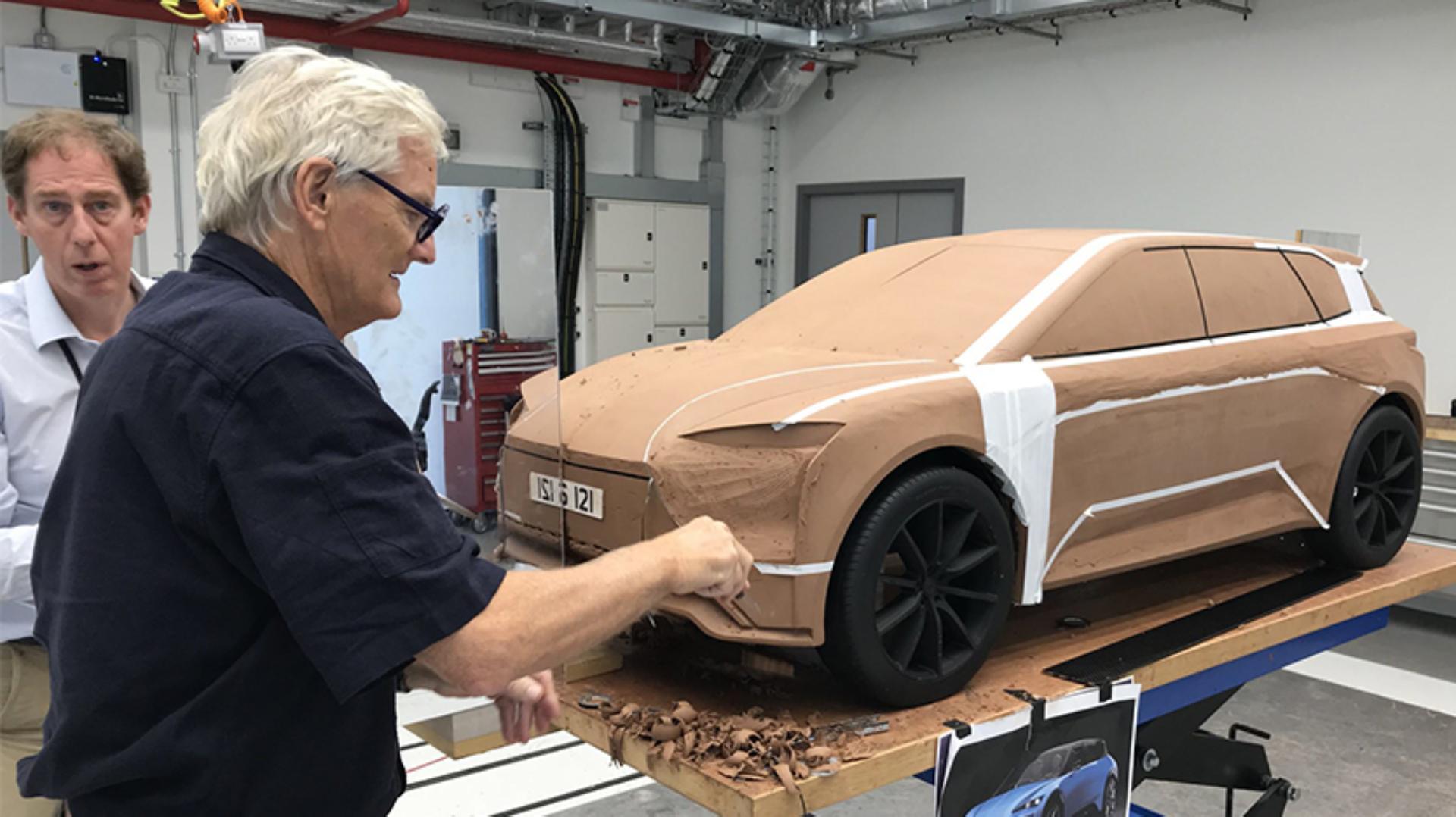 James Dyson with a scale clay model of the electric car