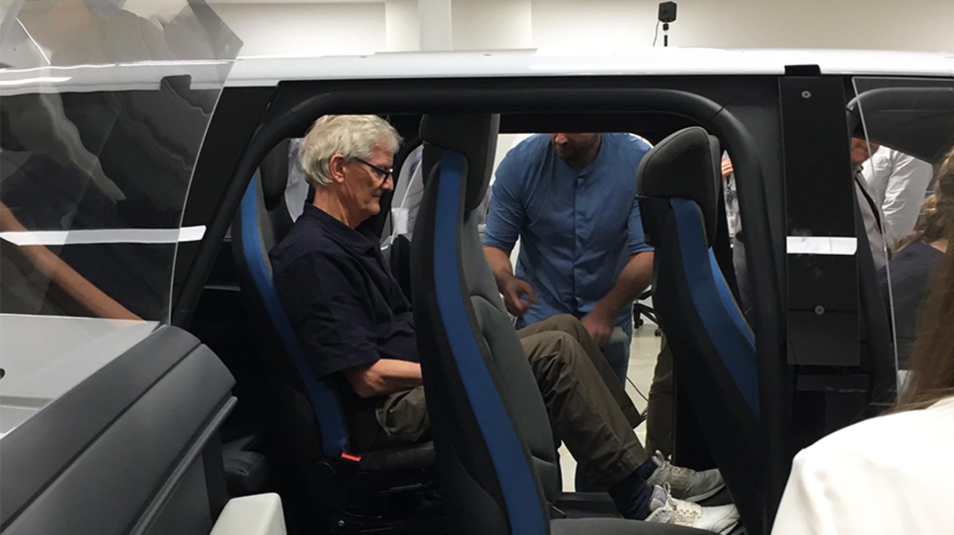 Profile view of James Dyson sitting in a test car frame