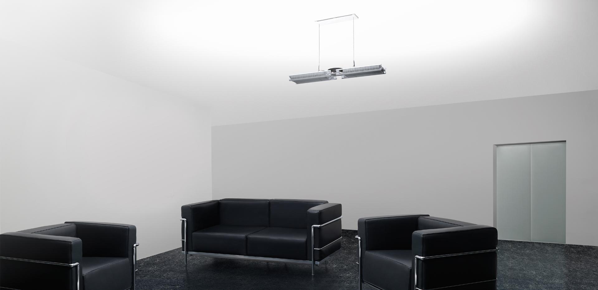 Dyson Cu-Beam Up light above sofas in an office lobby