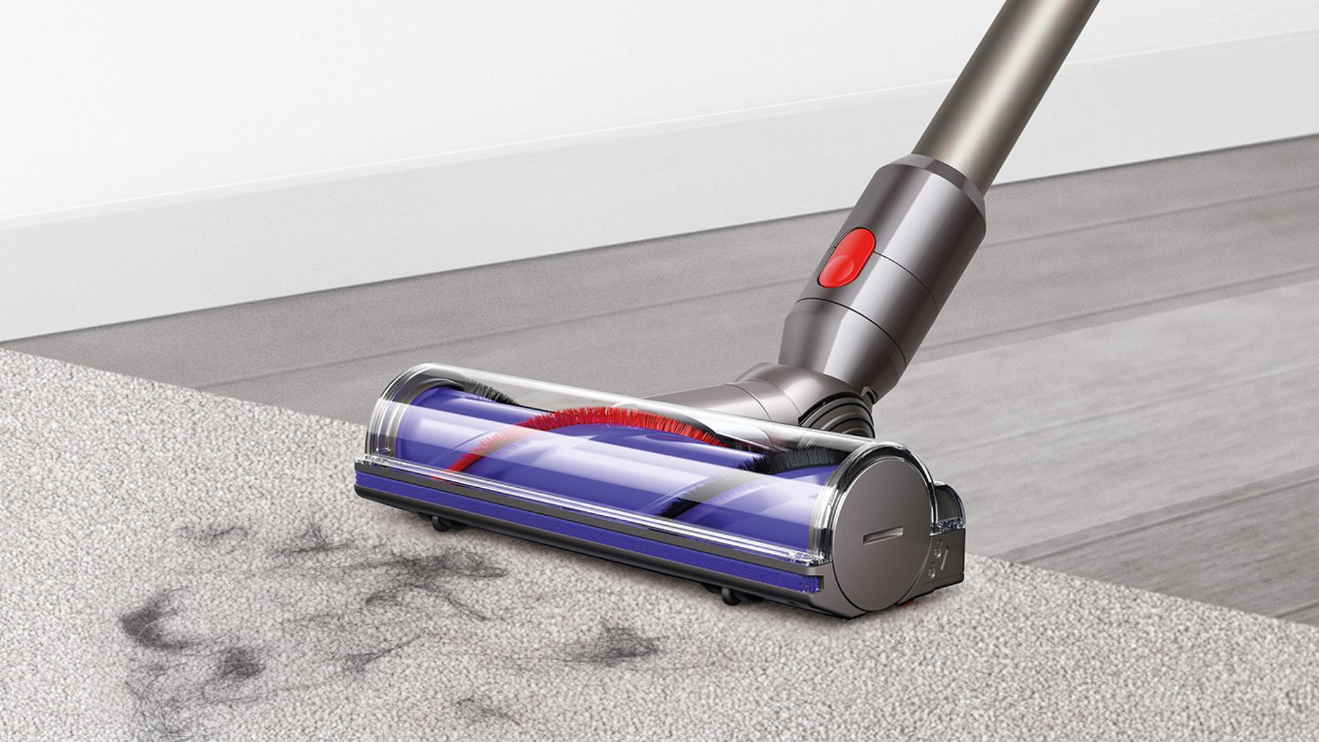 Dyson V8 direct drive cleaner head cleaning across carpet and hard floor
