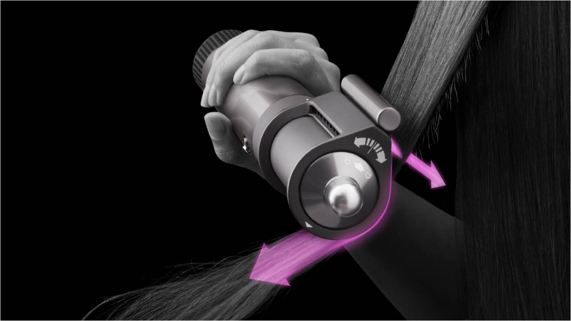 Woman using Dyson Airwrap multi-styler with Coanda smoothing dryer