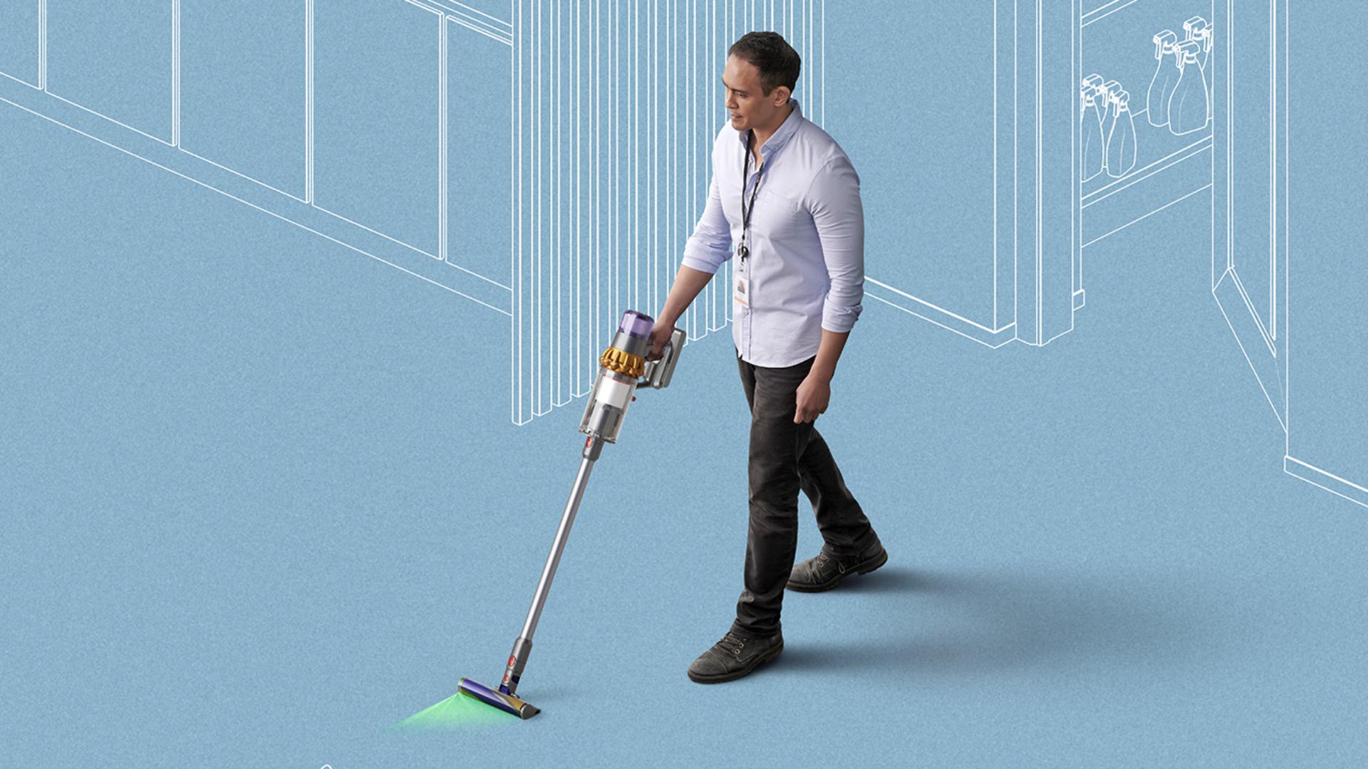 Man using Dyson cordless vacuum to clean floors