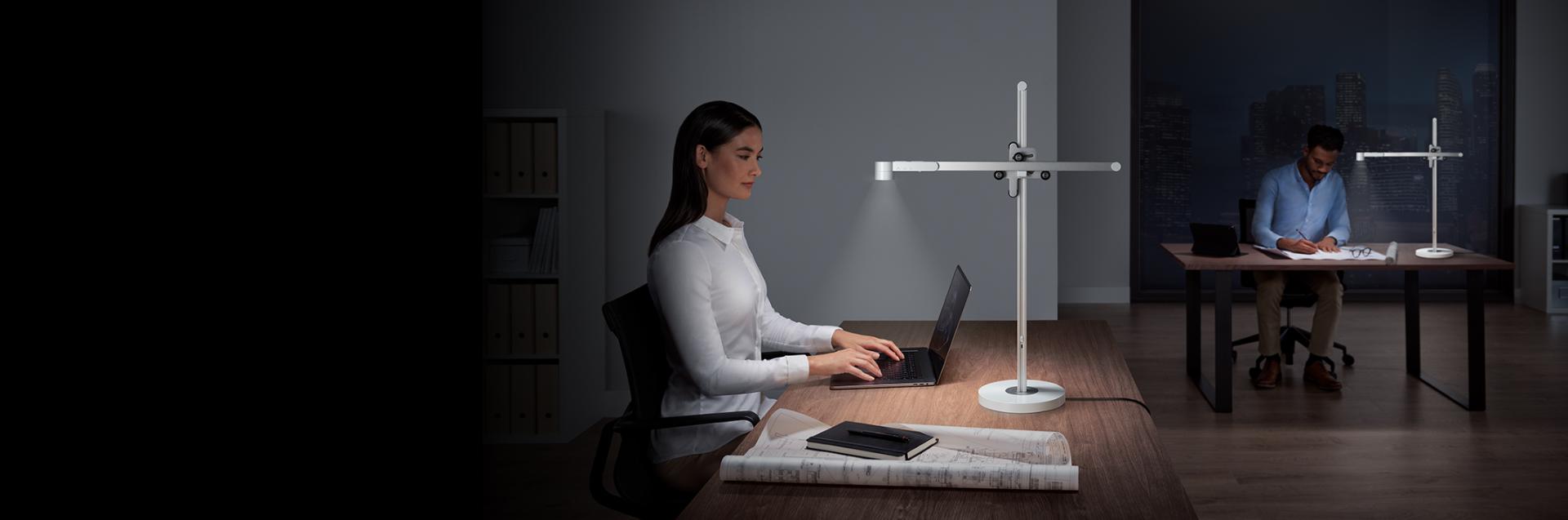 2 models using Dyson Lightcycle desk to work