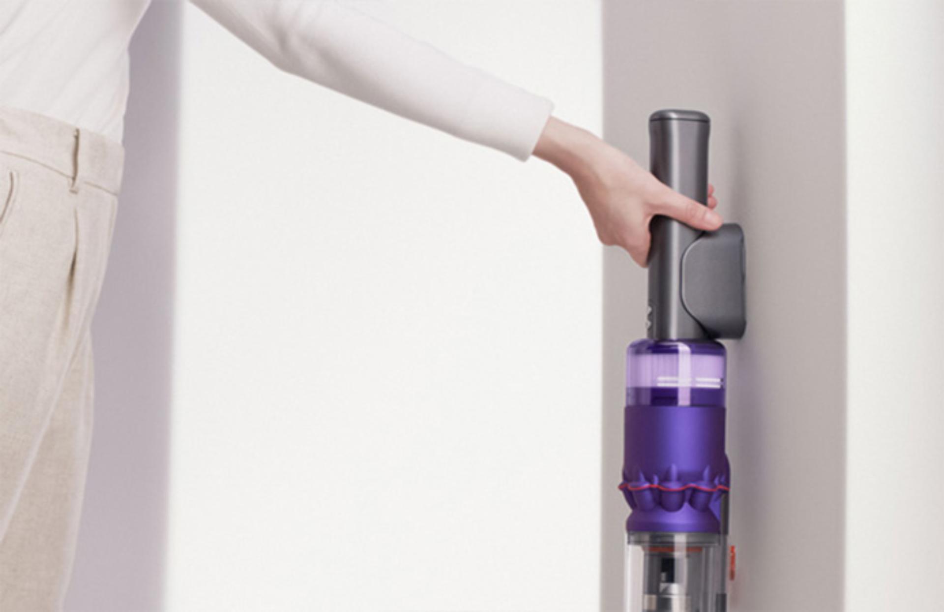 Dyson Omni-glide™ vacuum being placed into wall dock.