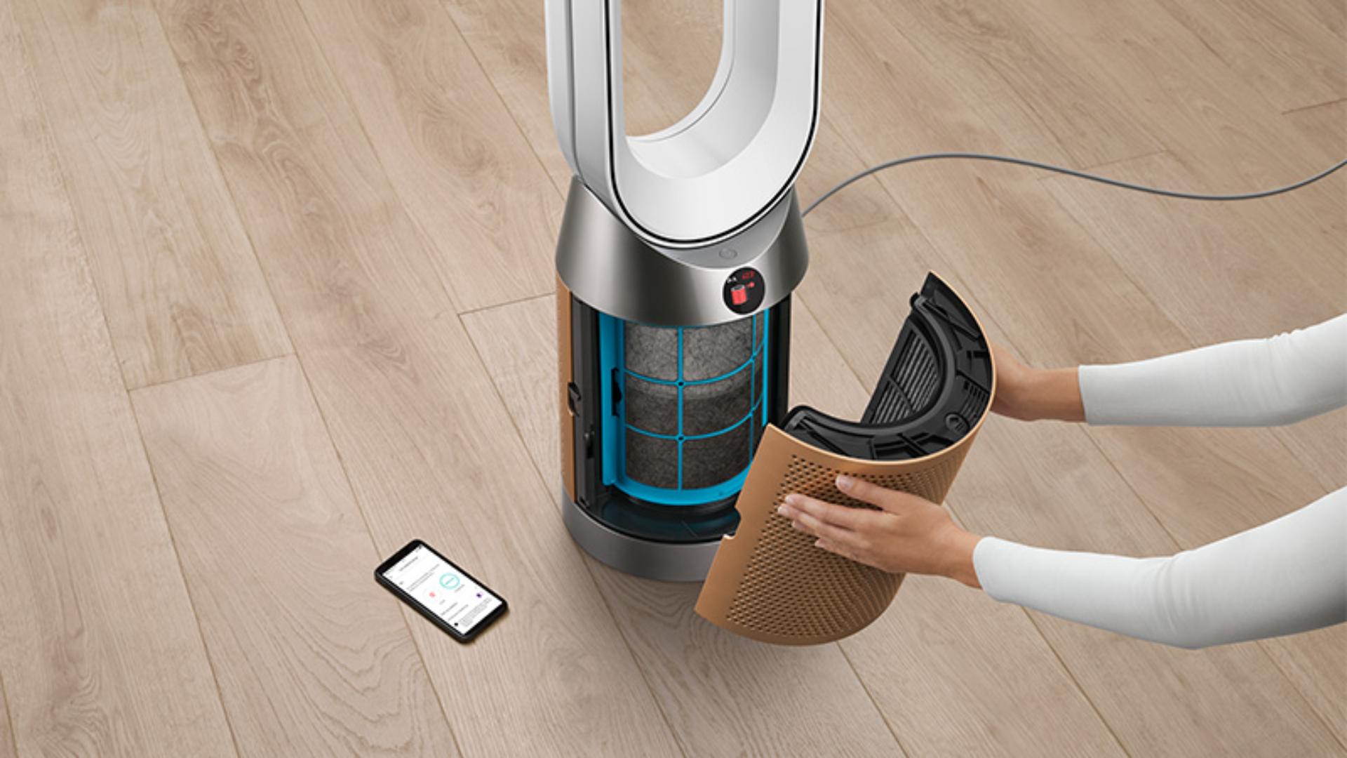 Someone changing a Dyson Purifier's filter